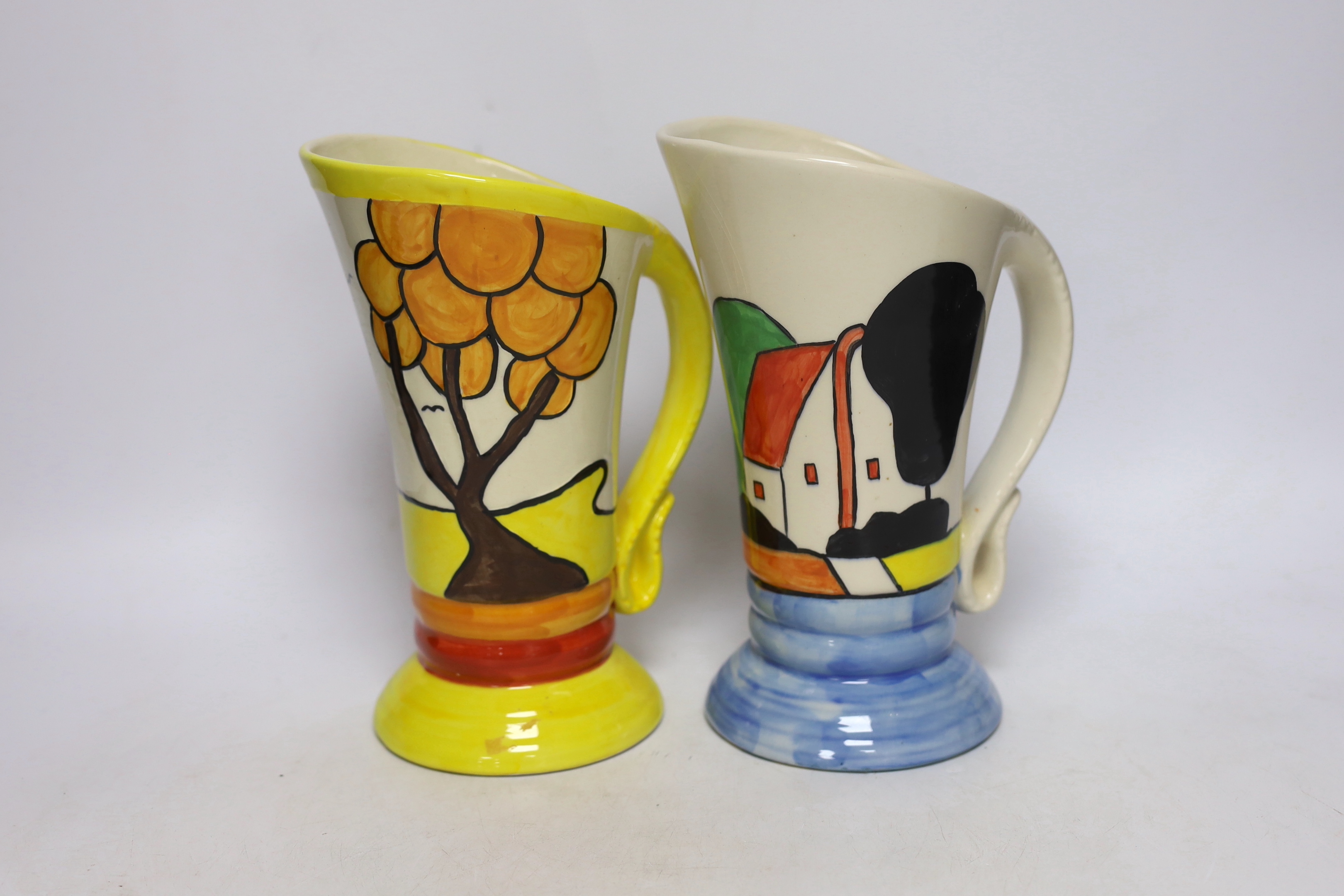 A Bernadette Eve Staffordshire jug, hand painted by Ty Will ‘Gardens’ and a similar Devon Ware jug, both in Clarice Cliff style, 23cm